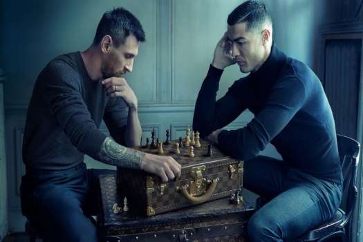 The iconic pair play chess in an advertisement for fashion powerhouse Louis Vuitton, marking their first-ever collaborative promotion. Cristiano Ronaldo and Lionel Messi